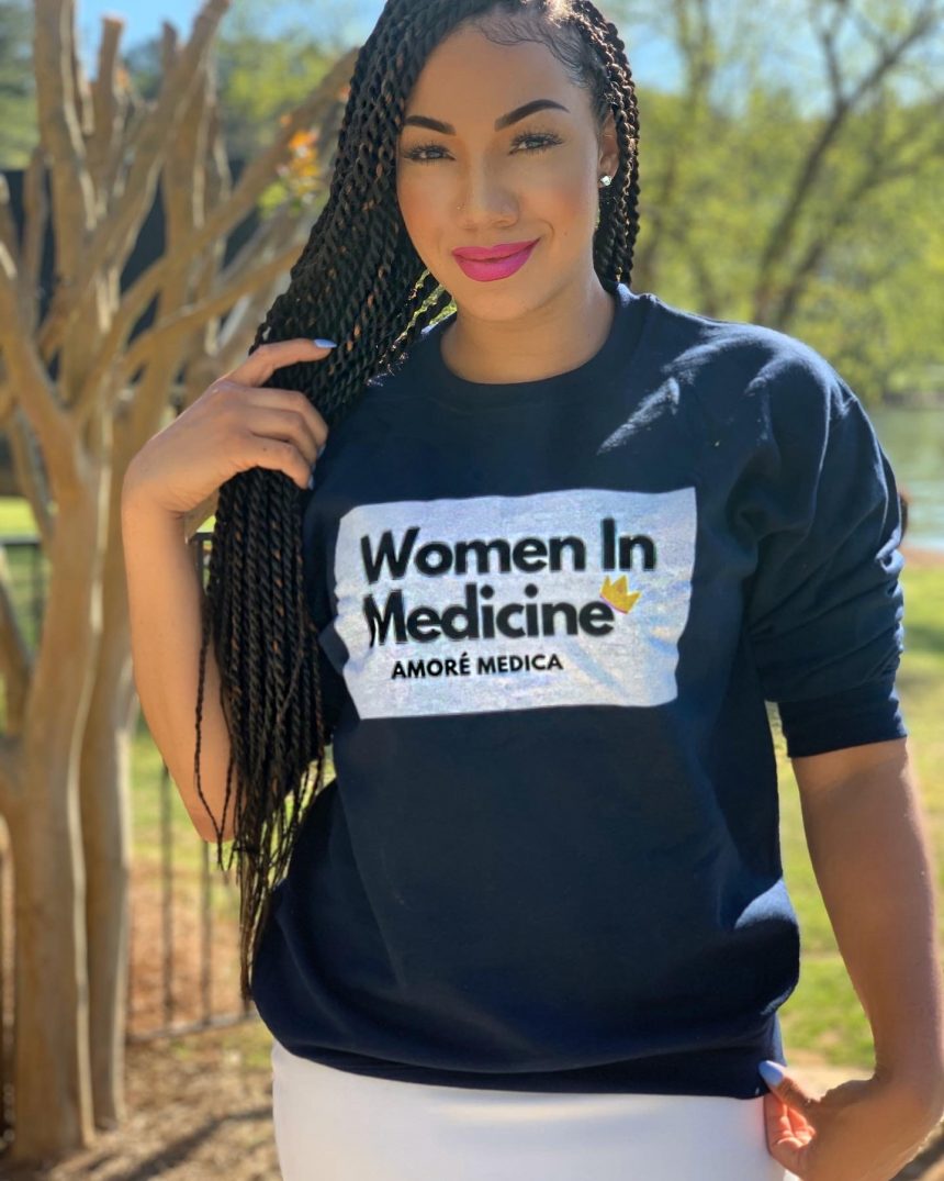 woman doctor in black women in medicine sweatshirt